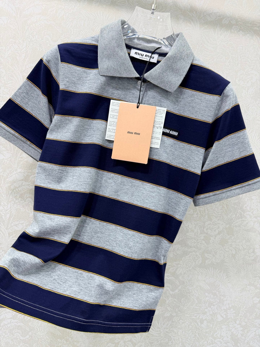 Striped collared short-sleeved polo shirt